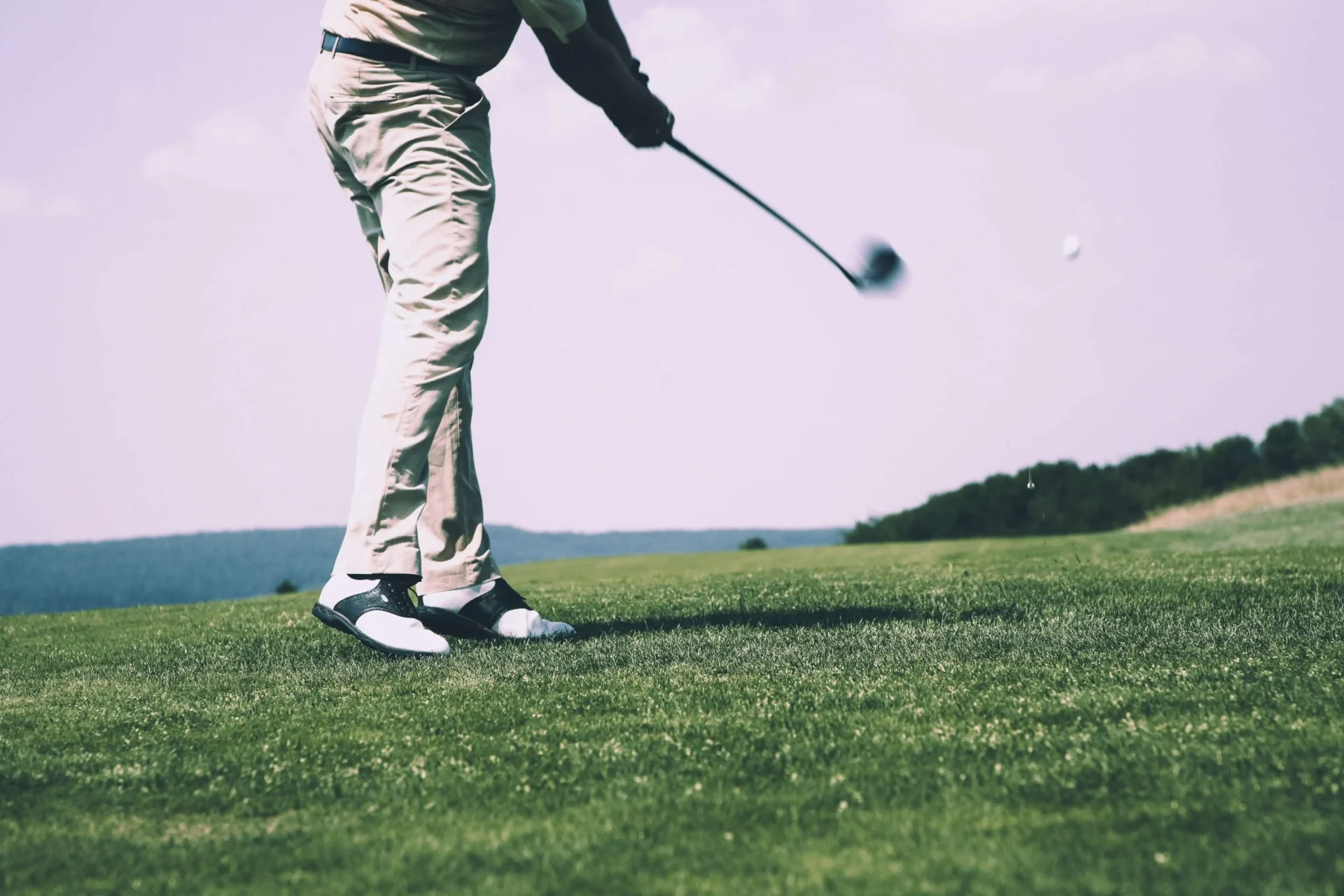 A man playing golf.