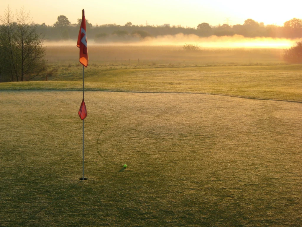A red flag on golf course.