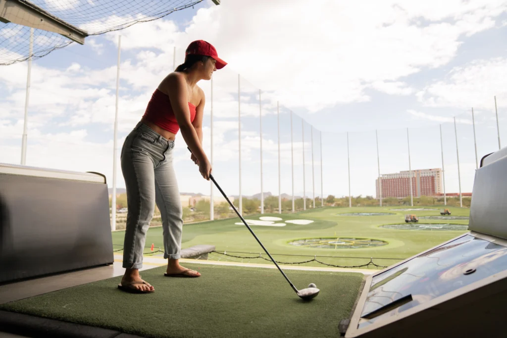 Woman playing golf during daytime photo