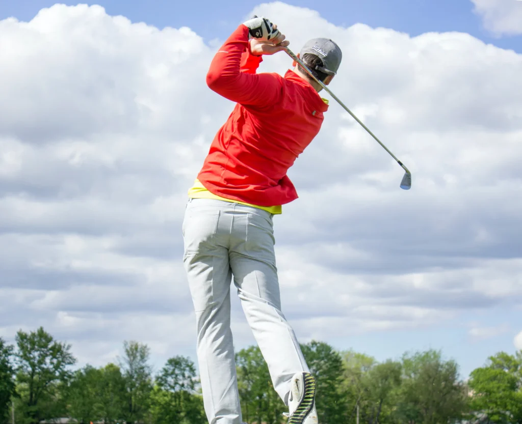 Man in red long-sleeved top golf photo
